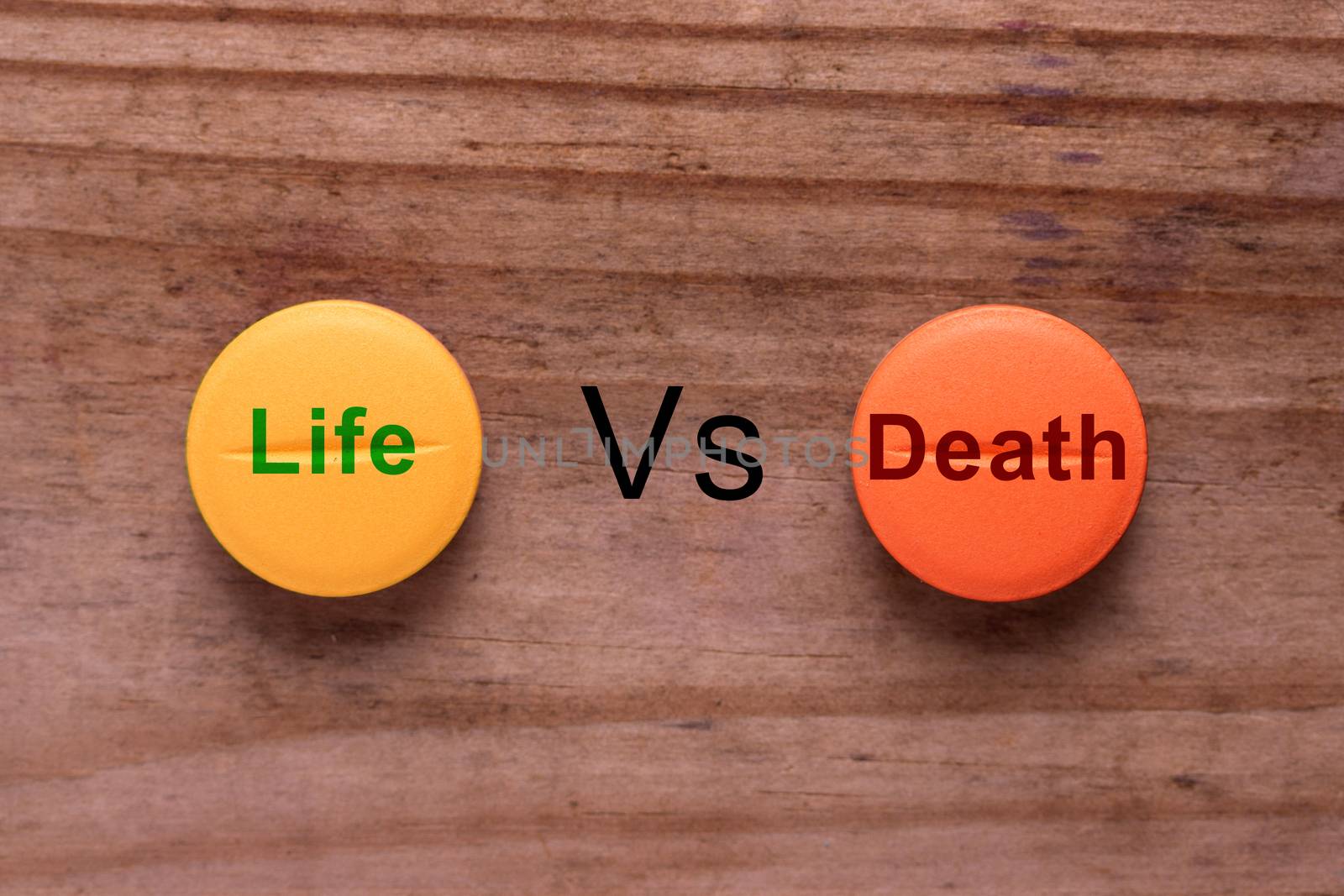 terminal illness treatment concept. pill with words life vs death