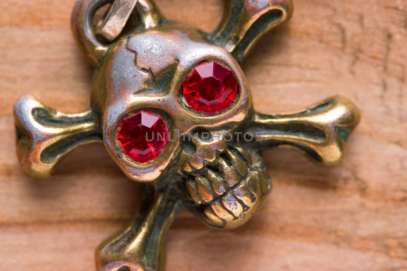 close up of metal skull with red eyes. pirate concept