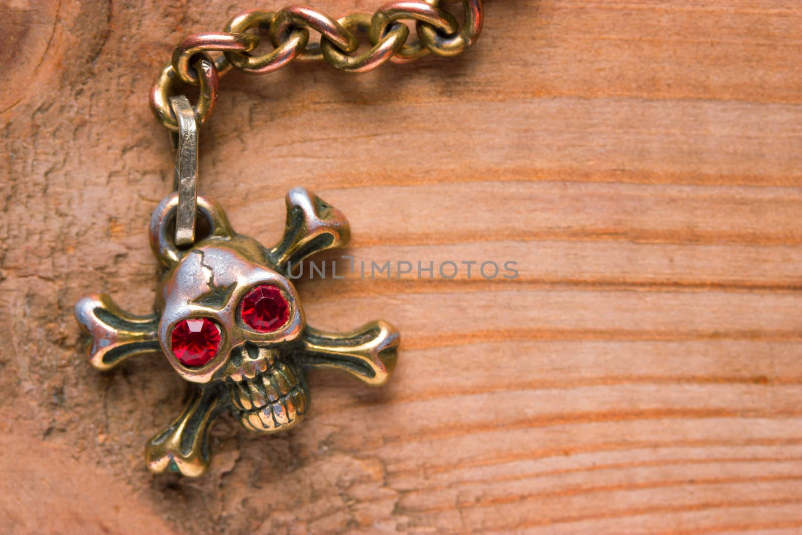 close up of metal skull with red eyes. pirate concept