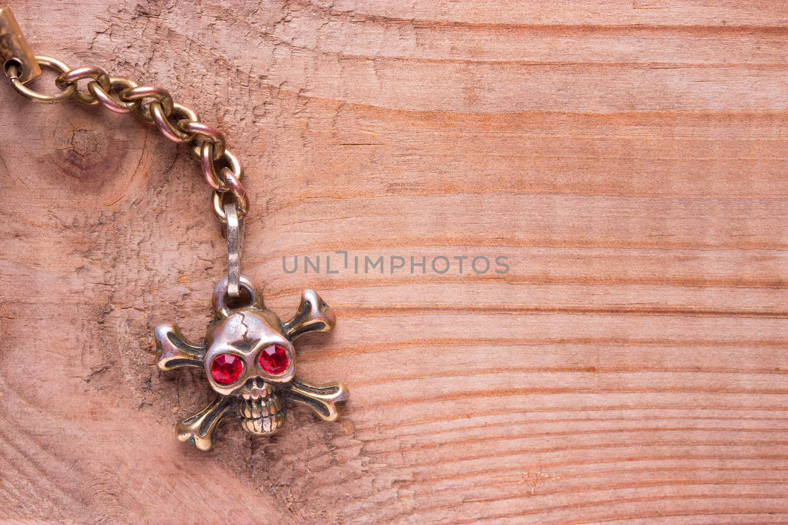 metal skull with red eyes. copy space