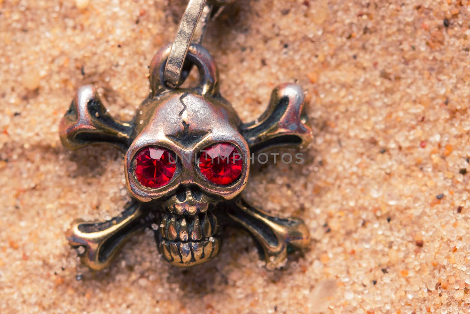 close up of metal skull with red eyes by liwei12