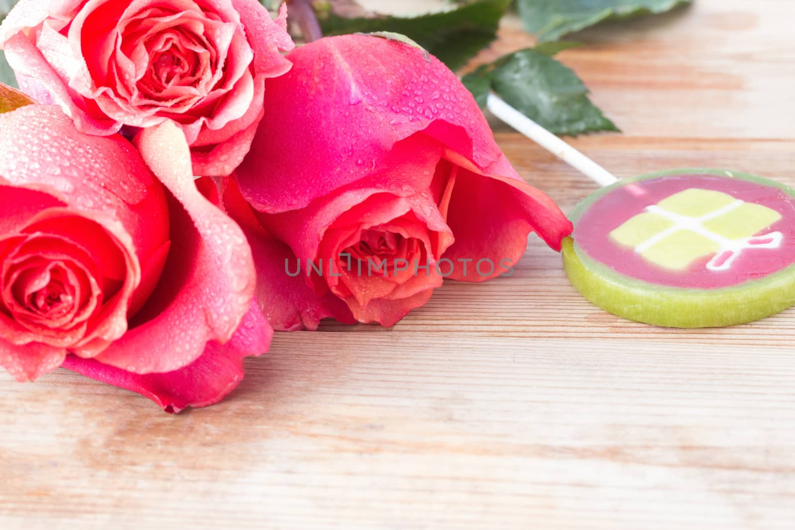 pink roses and sweets on table. copy space
