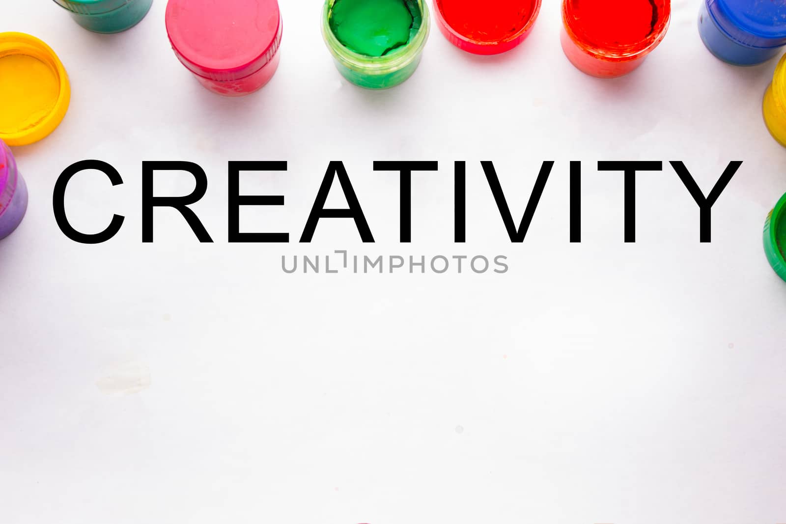 creativity concept.colorful sign and paint cans. not isolated