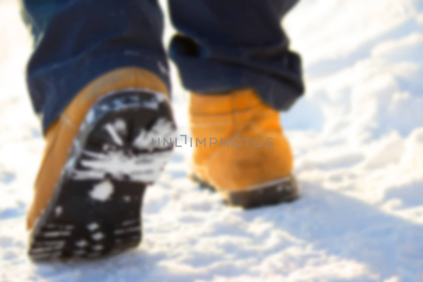 men legs in shoes for extreme tourism. winter. blurred