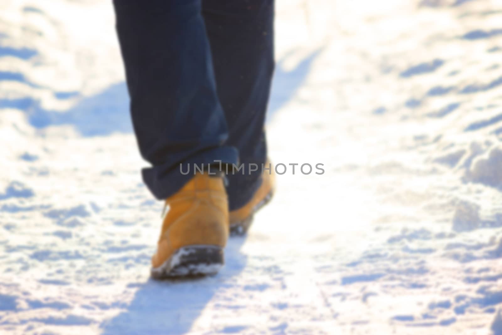 unfocused mans leg in winter. sport in winter concept