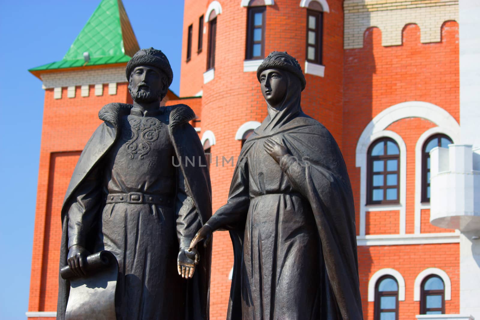 sculptures of man and woman. owners of medieval castle