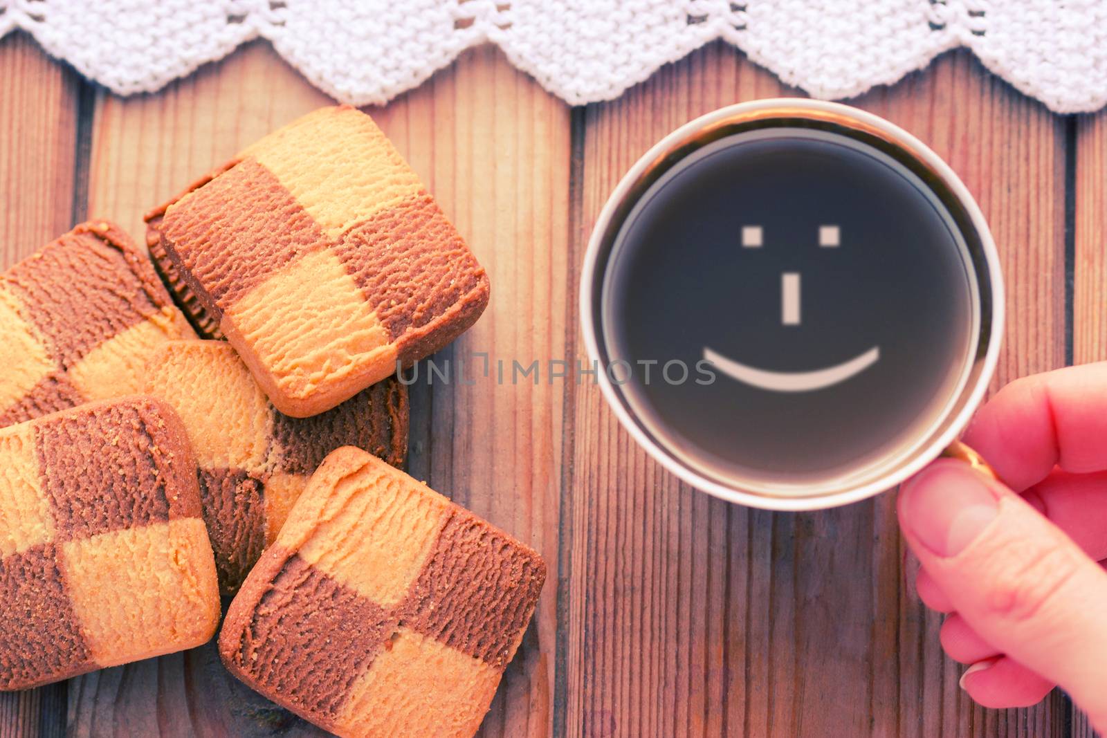 Good morning coffee smile cup on wooden background and cookies