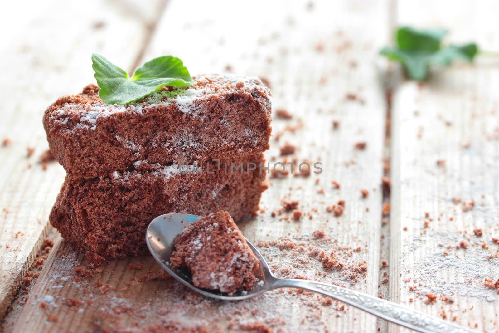 Brownie, closeup chocolate cake on a rustic wooden table, selective focus