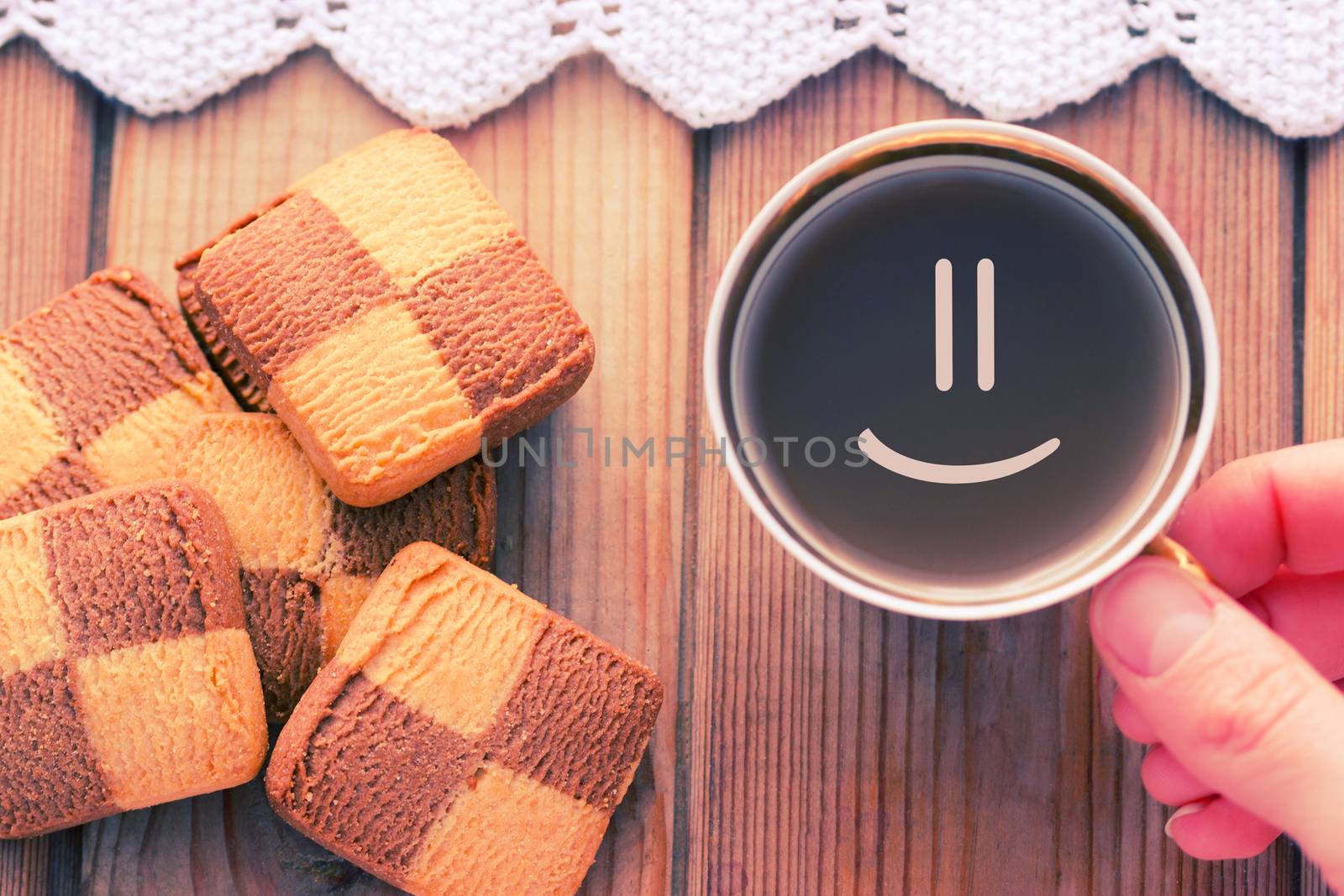 Good morning coffee smile cup on wooden background and cookies