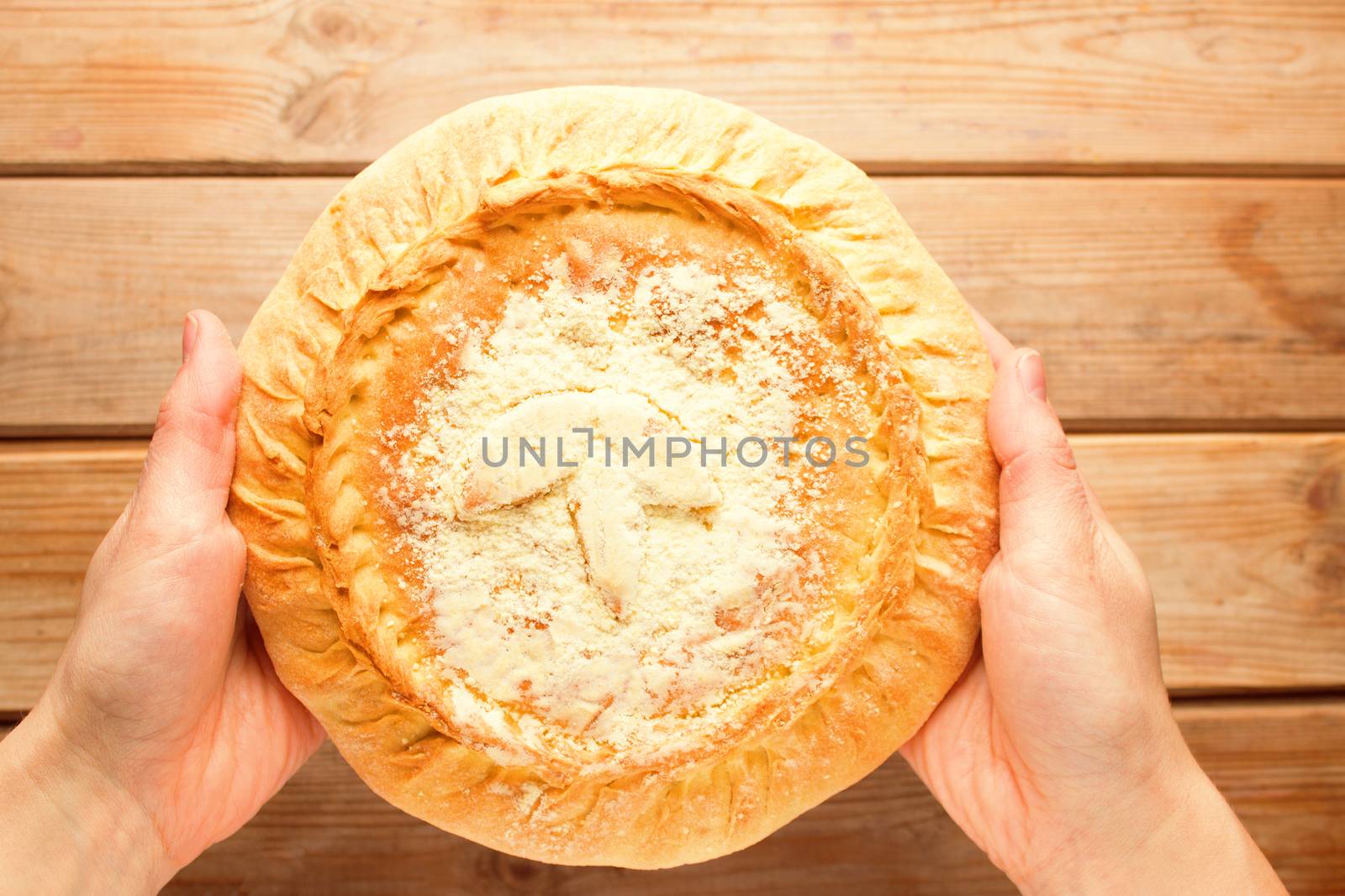 fresh baking Apple pie cake in hands