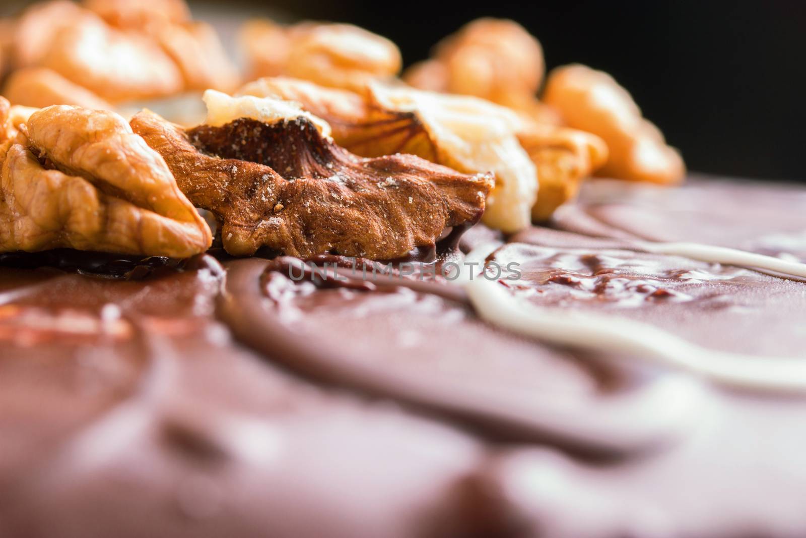 close up of chocolate cake with nuts