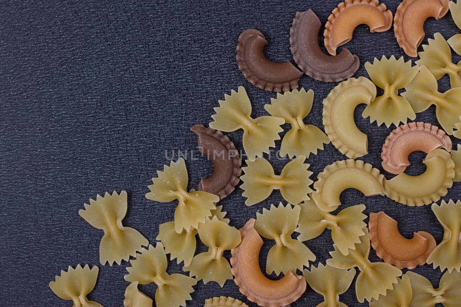 Variety of types of Italian pasta background by victosha