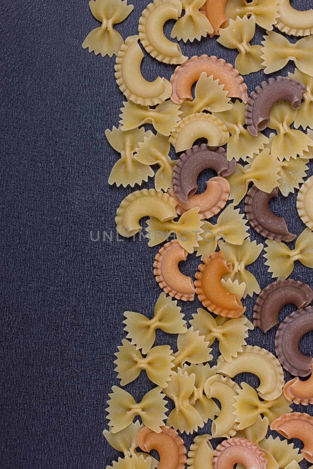 Variety of types of Italian pasta background by victosha