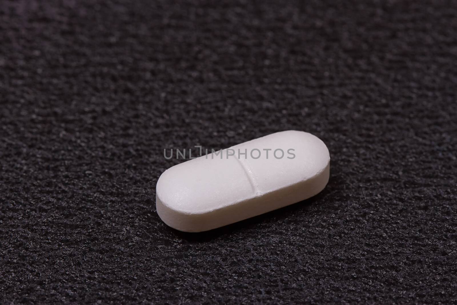 close up white pills by victosha