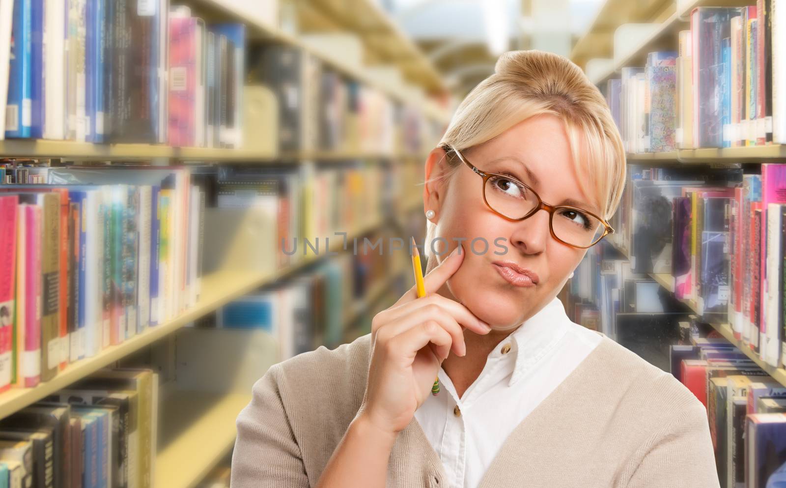 Beautiful Expressive Student or Teacher with Pencil in Library.