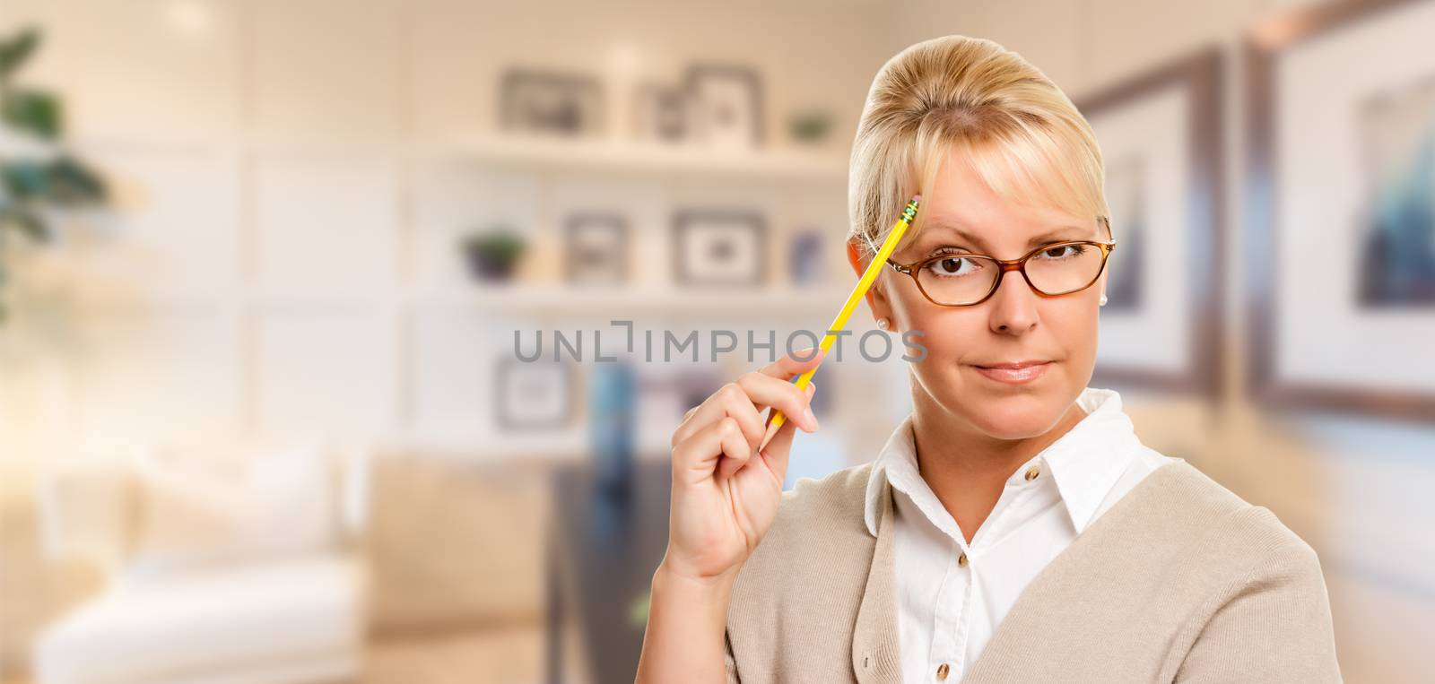 Beautiful Expressive Student or Businesswoman with Pencil in Office.