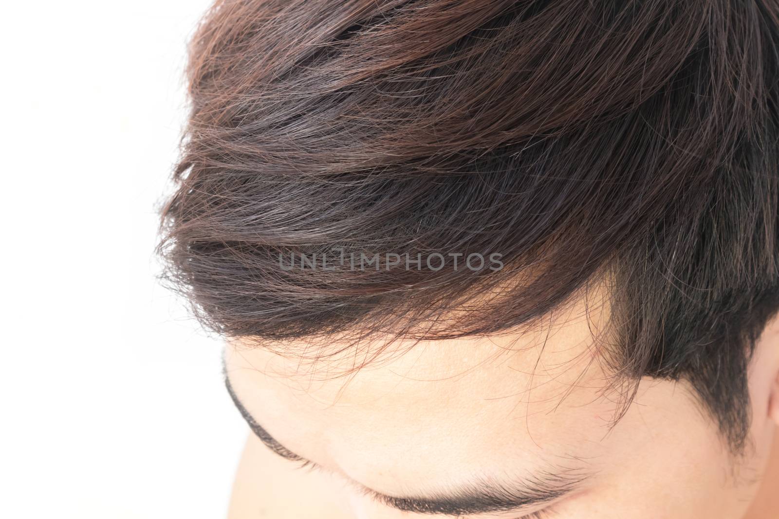 Young man worry hair loss problem for health care shampoo and beauty product concept