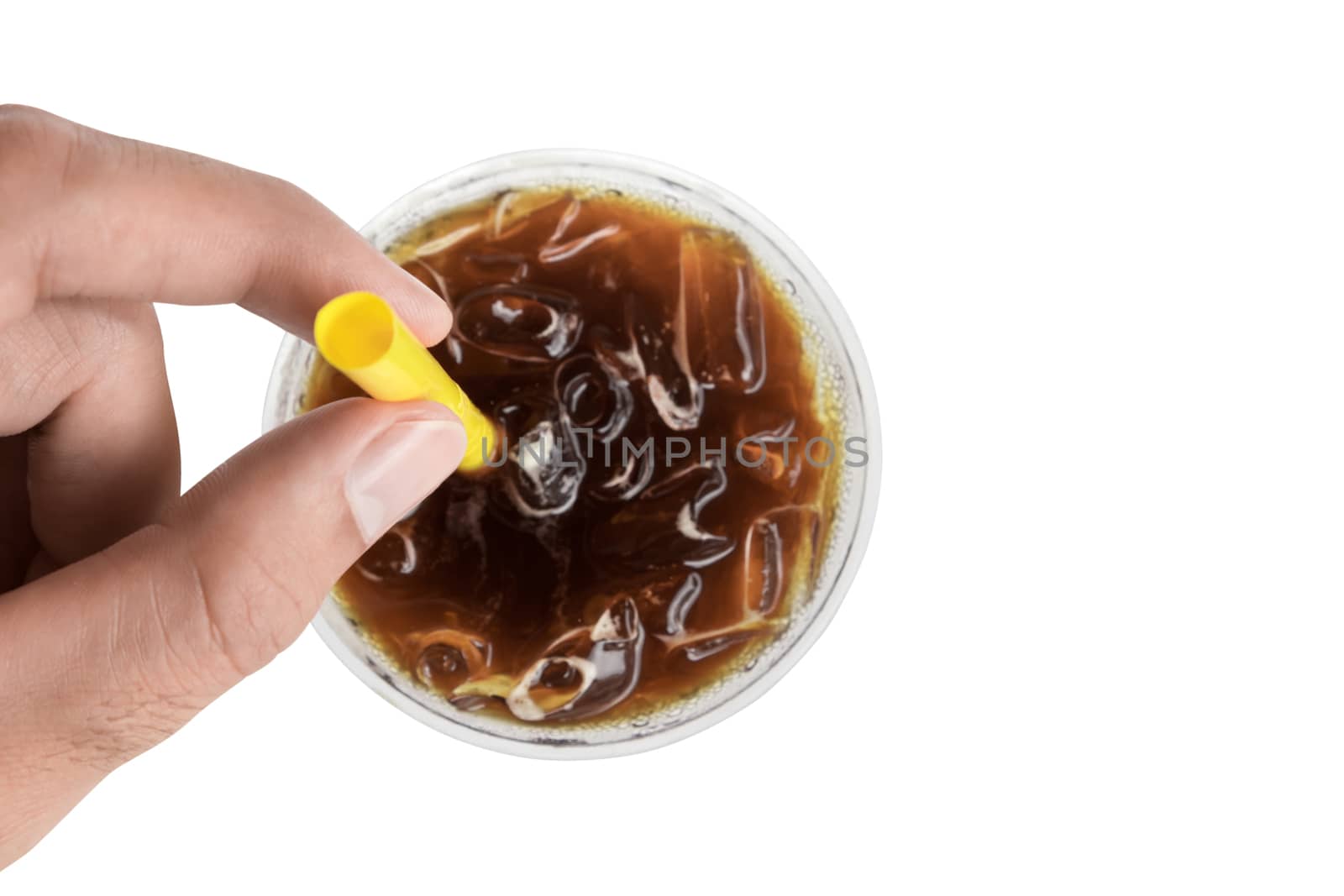 Closeup top view hand hold ice of americano coffee with yellow straw on white background