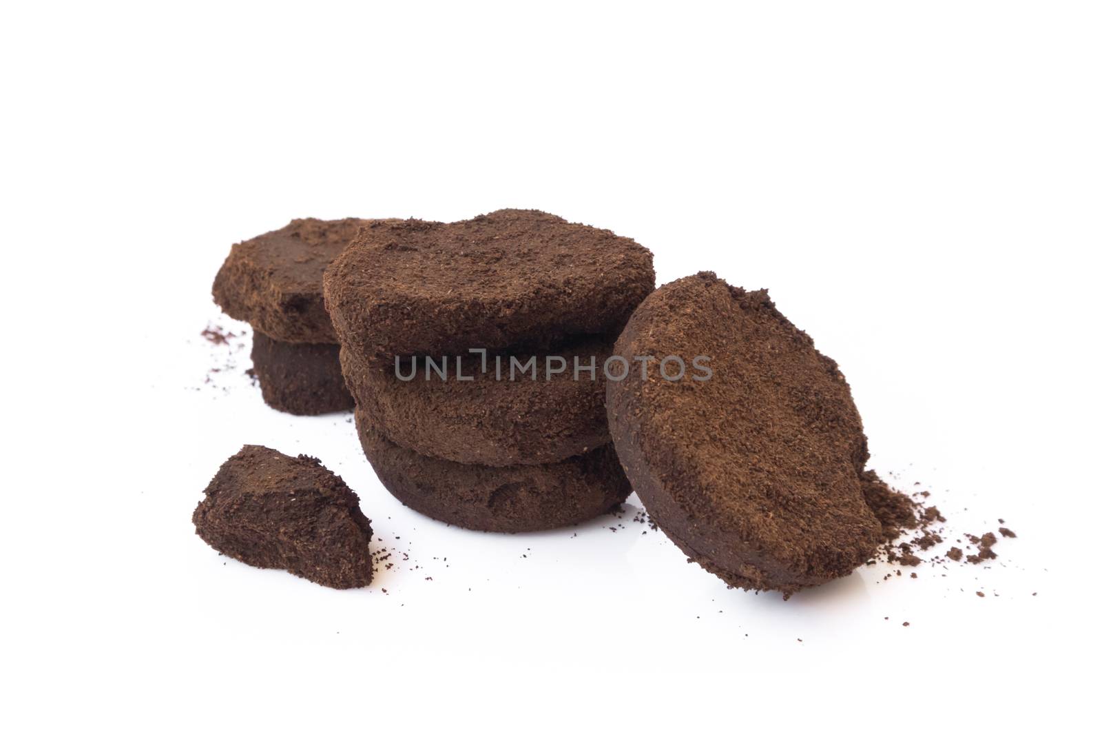 Closeup coffee grounds on white background