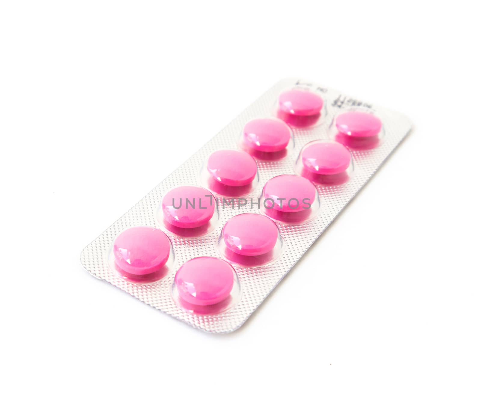 Pink pills in blister pack on white background by pt.pongsak@gmail.com