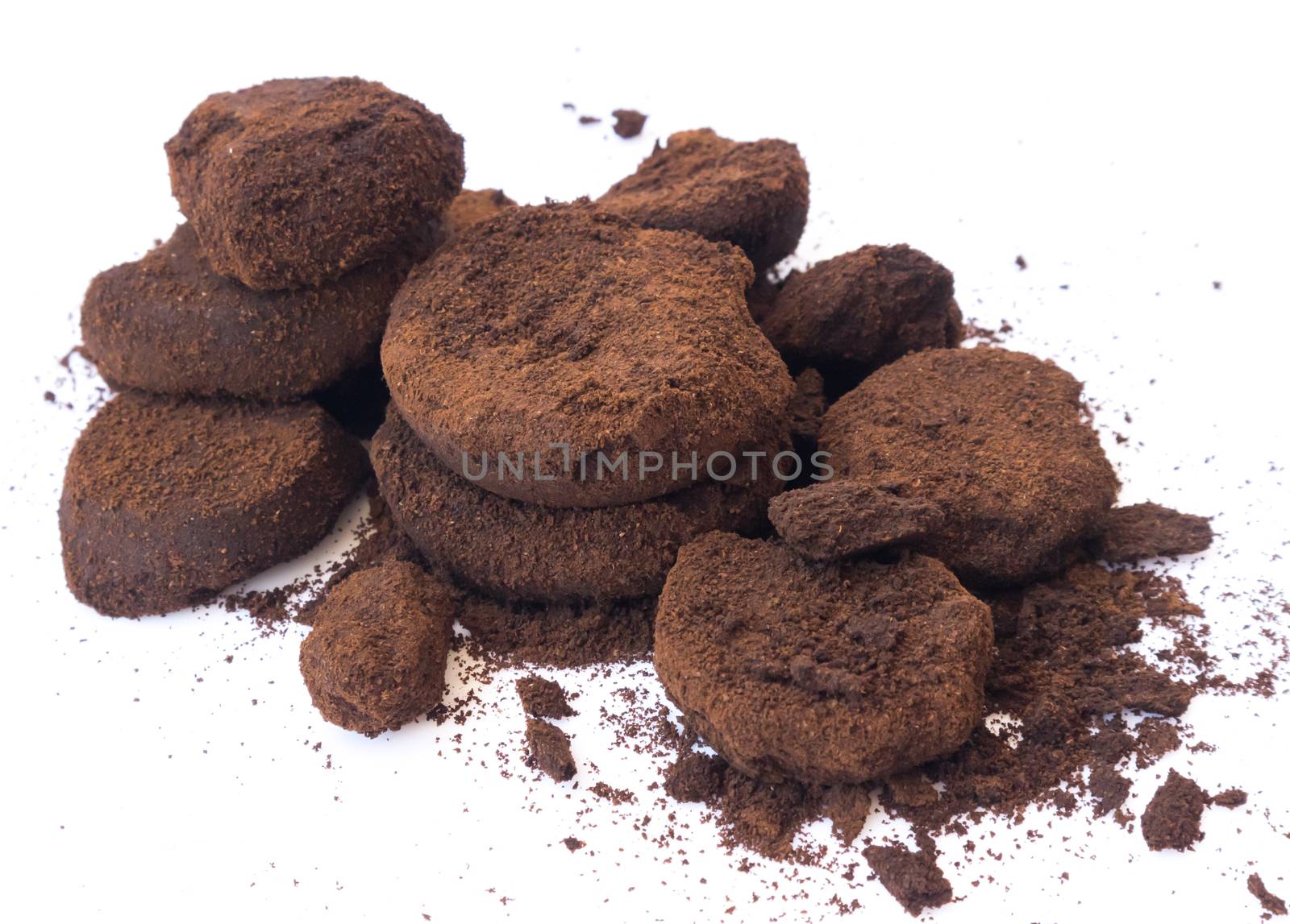 Closeup coffee grounds on white background by pt.pongsak@gmail.com