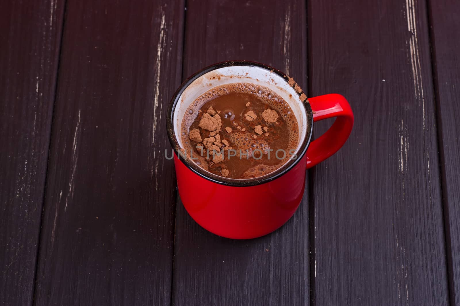 Aromatic cocoa drink. On black rustic background