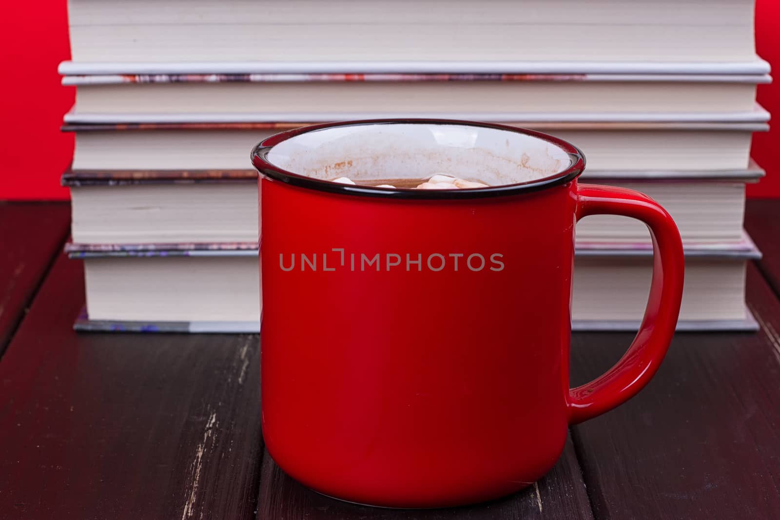 Old vintage books and a red mug