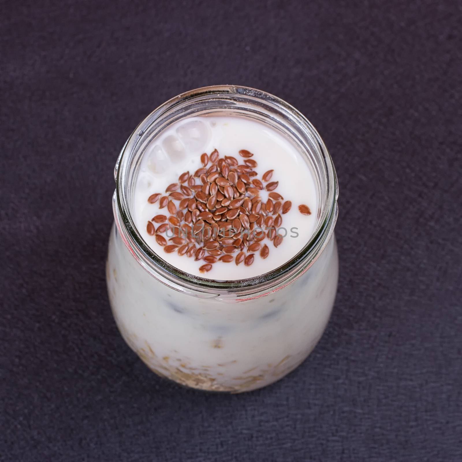 Healthy breakfast - yogurt with blueberries and muesli served in glass jar by victosha