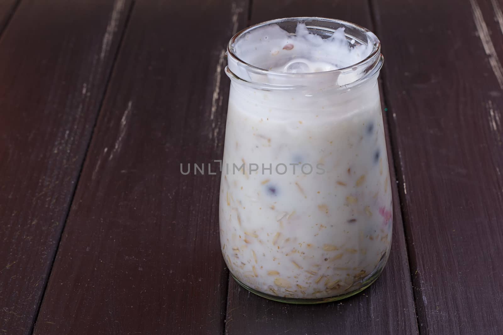 Healthy breakfast - yogurt with blueberries and muesli served in glass jar by victosha