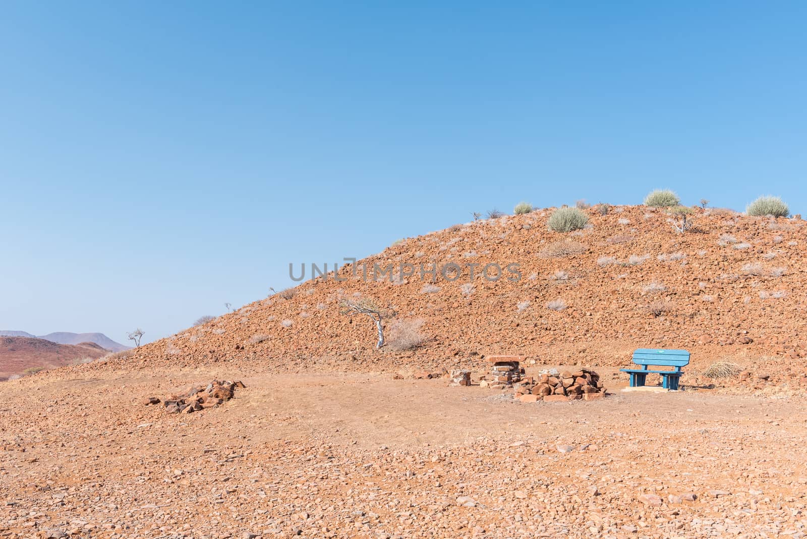 A picnic spot with blue bench at the top of Dopsteekhoogte Pass on the C39-road to Torra Bay, in the Kunene Region of Namibia