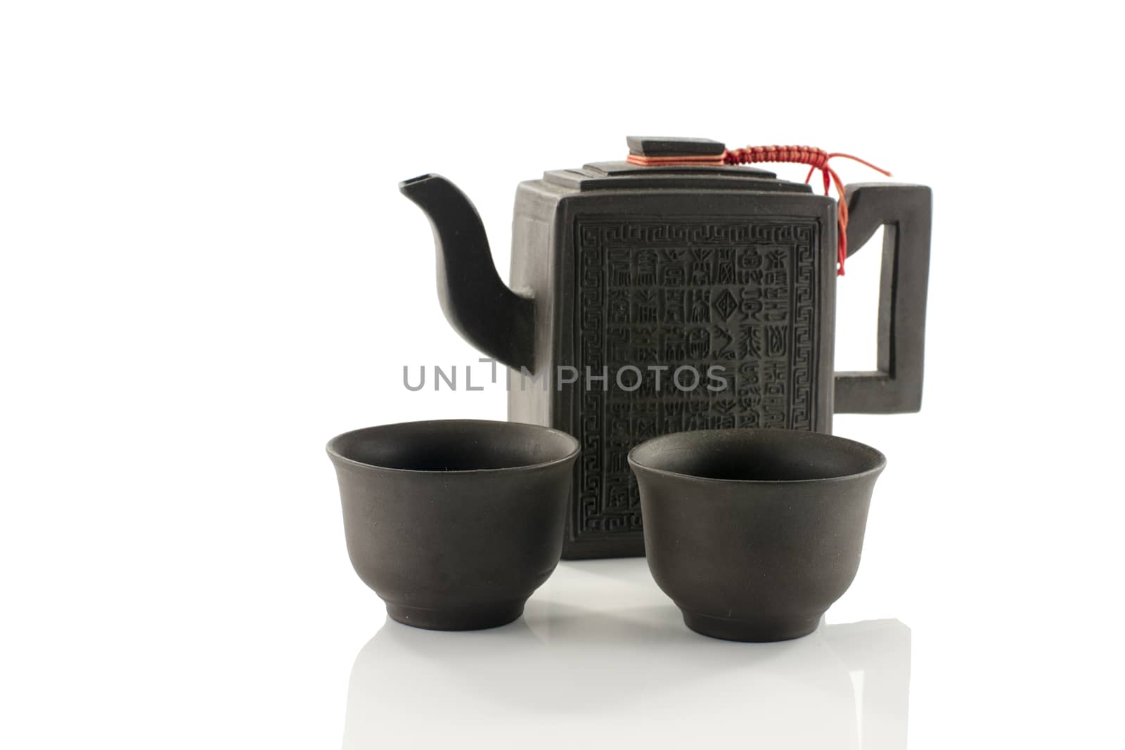 asian teapot and two cups isolated on white