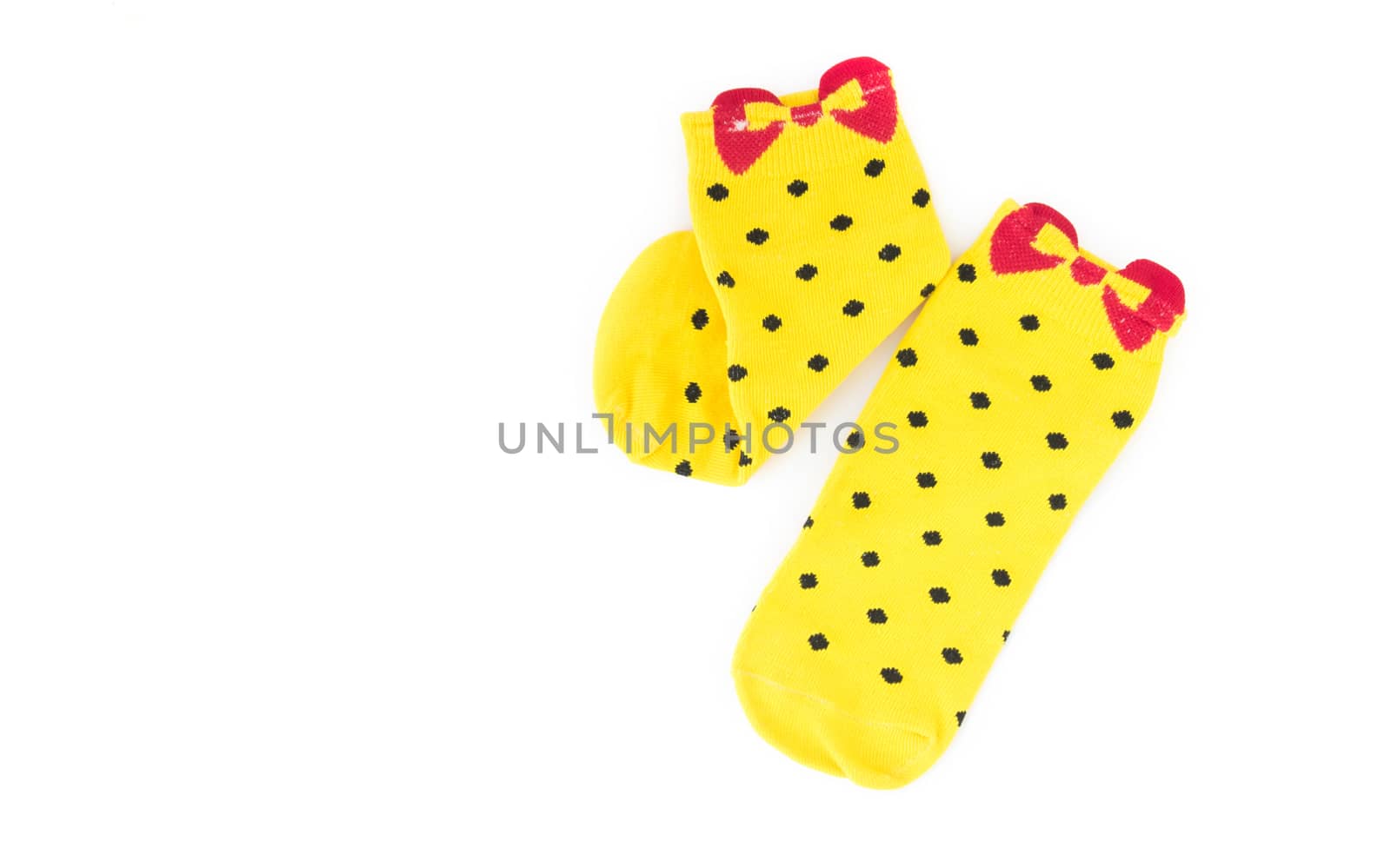 Cute yellow socks on white background by pt.pongsak@gmail.com