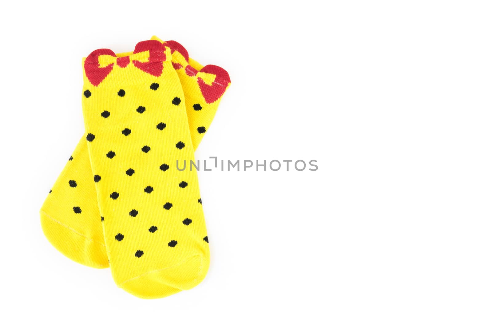 Cute yellow socks on white background by pt.pongsak@gmail.com