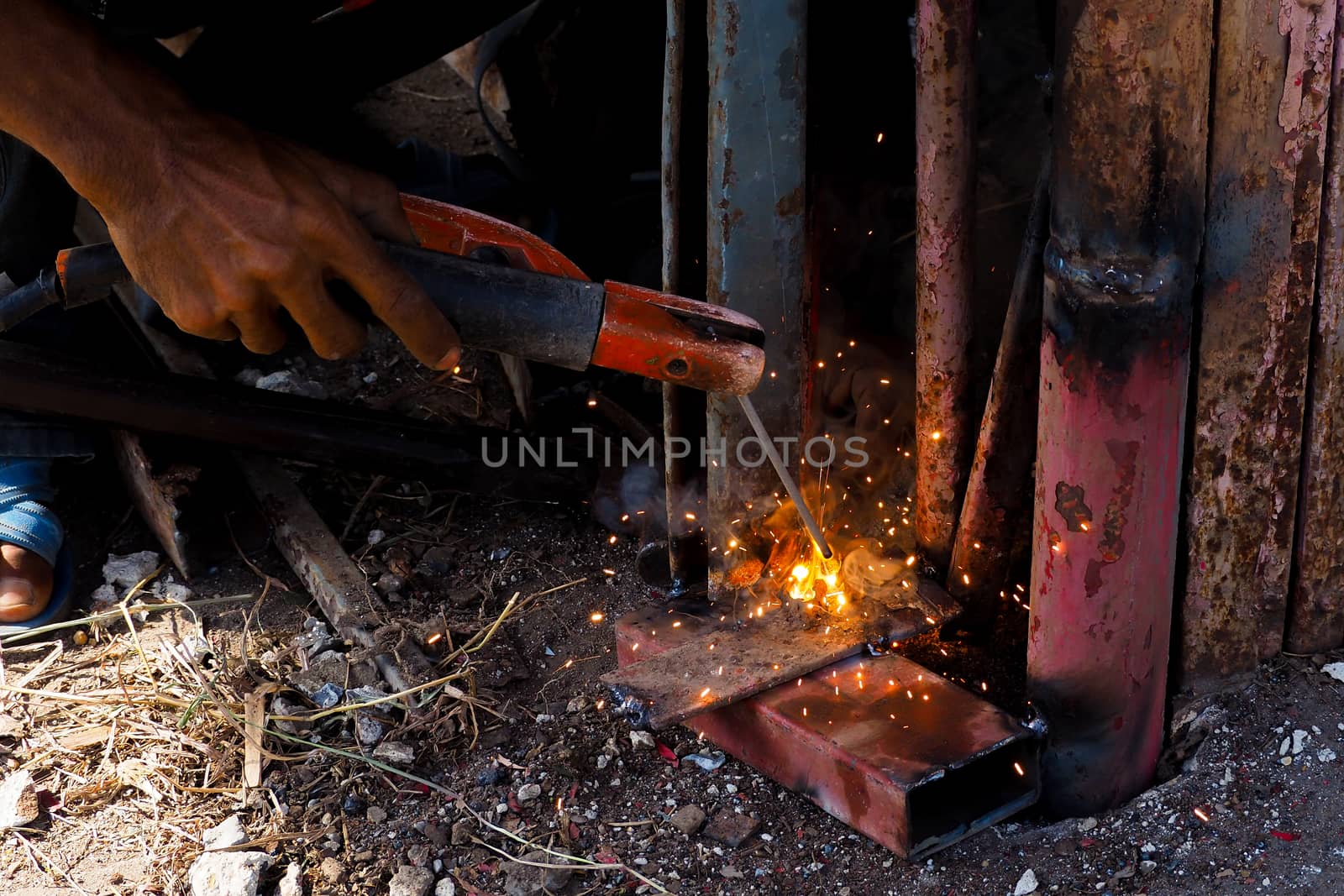 Arc welding and welding fumes, Worker welding on steel in the job site.