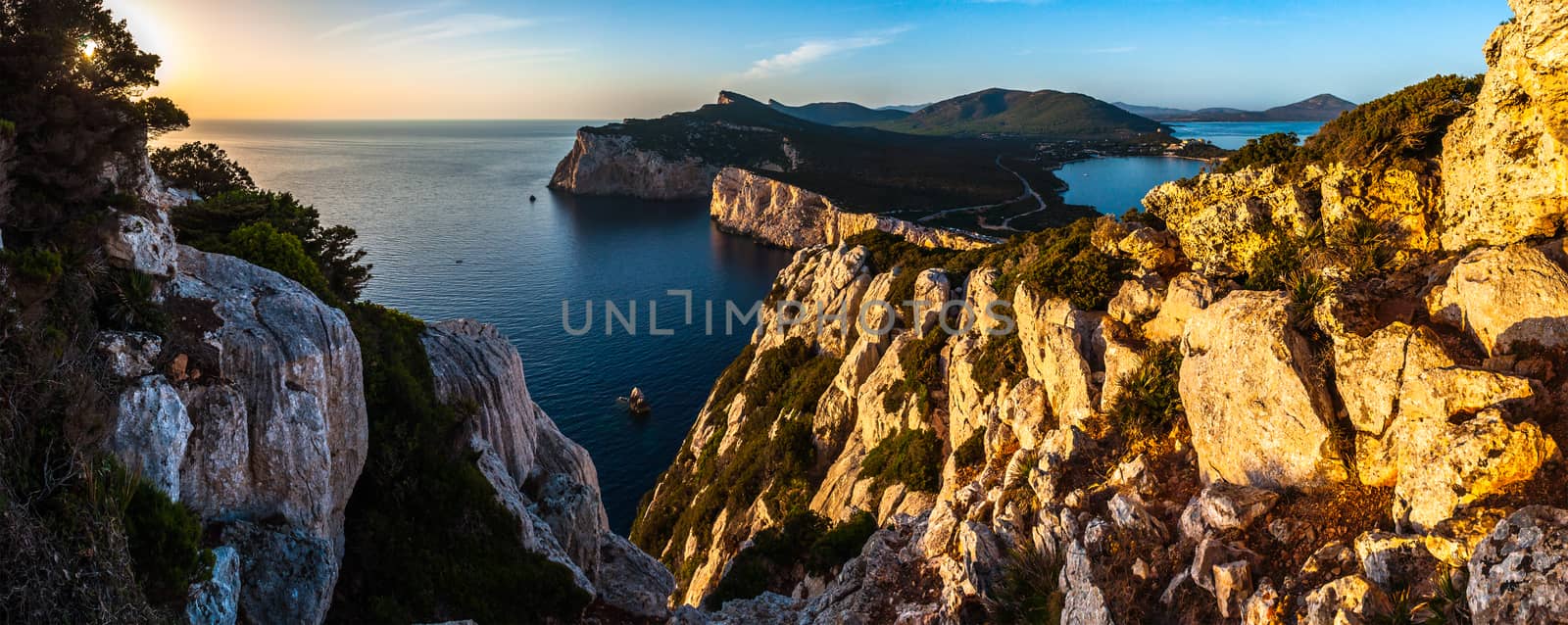 Landscape of the gulf of capo caccia from the Cave of broken vessels at sunset