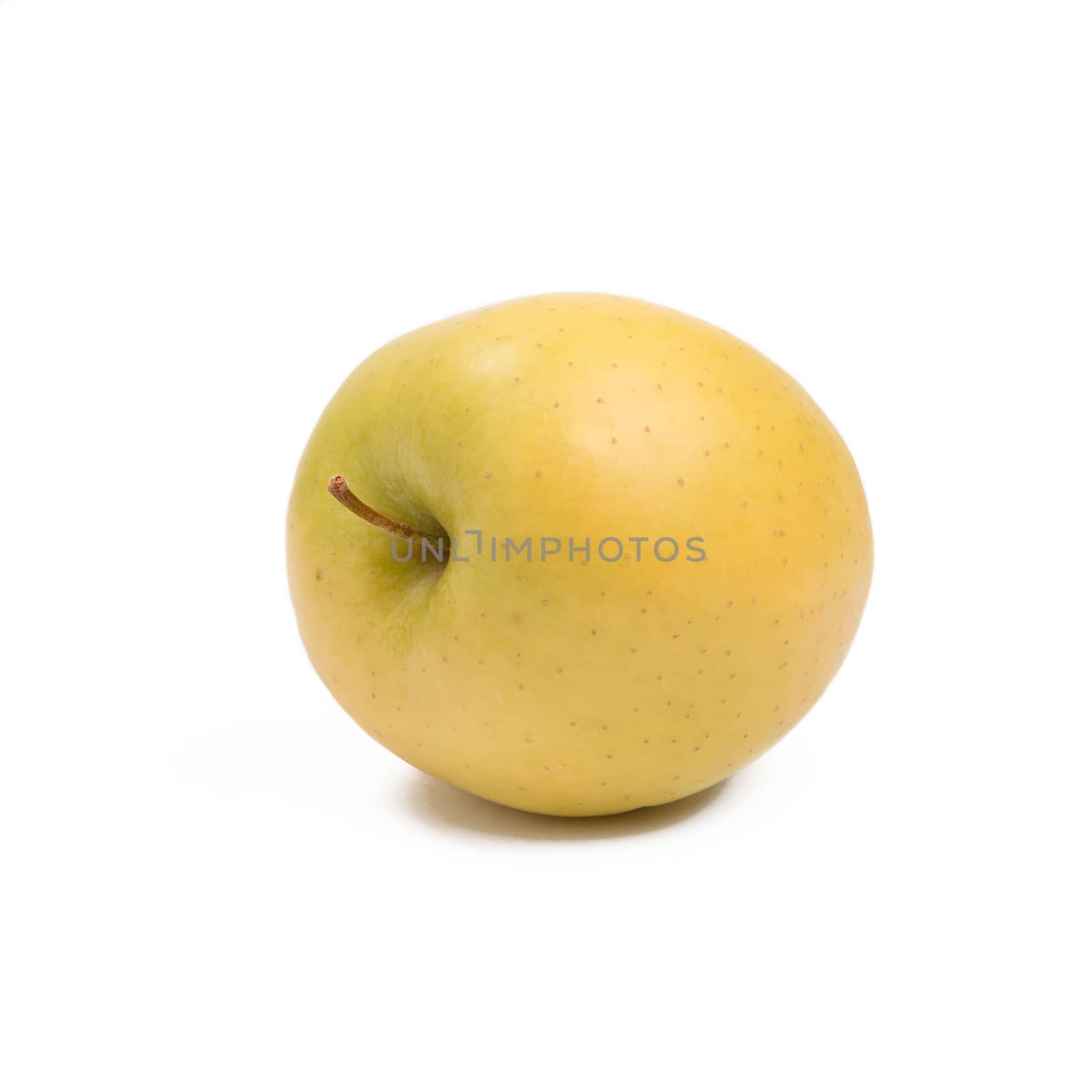 ripe yellow apple isolated on white background