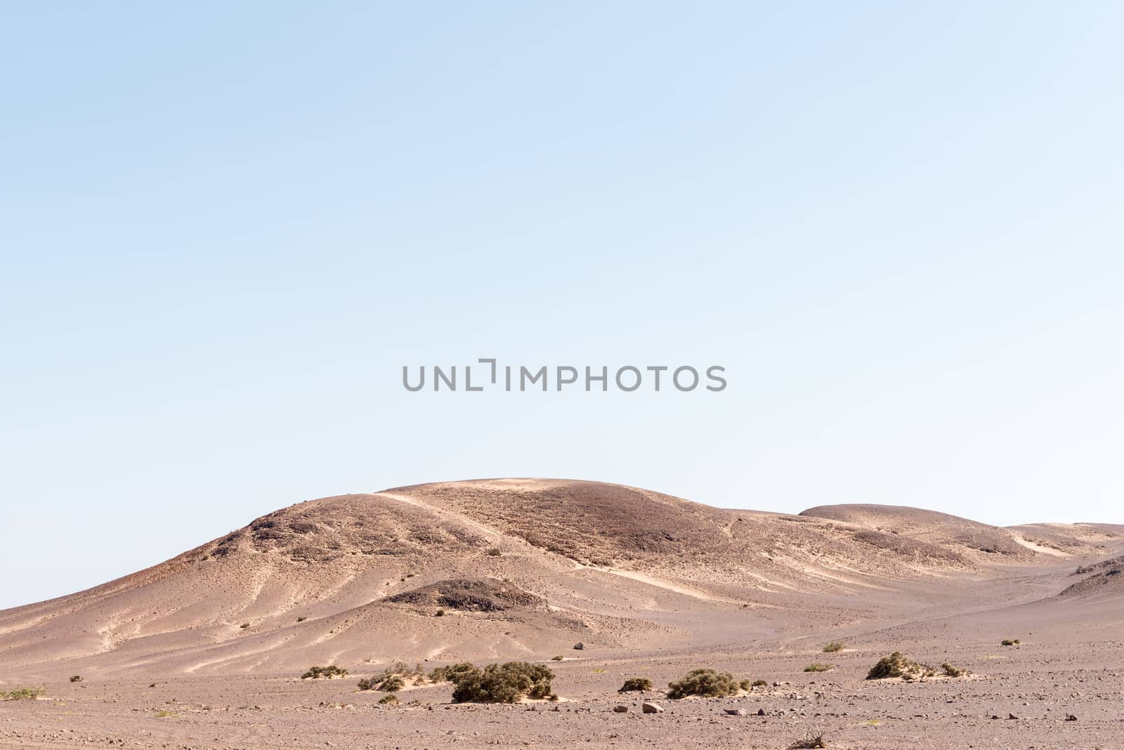 A rock and sand Namib desert landscape near Springbokwasser in the Kunene Region of Namibia