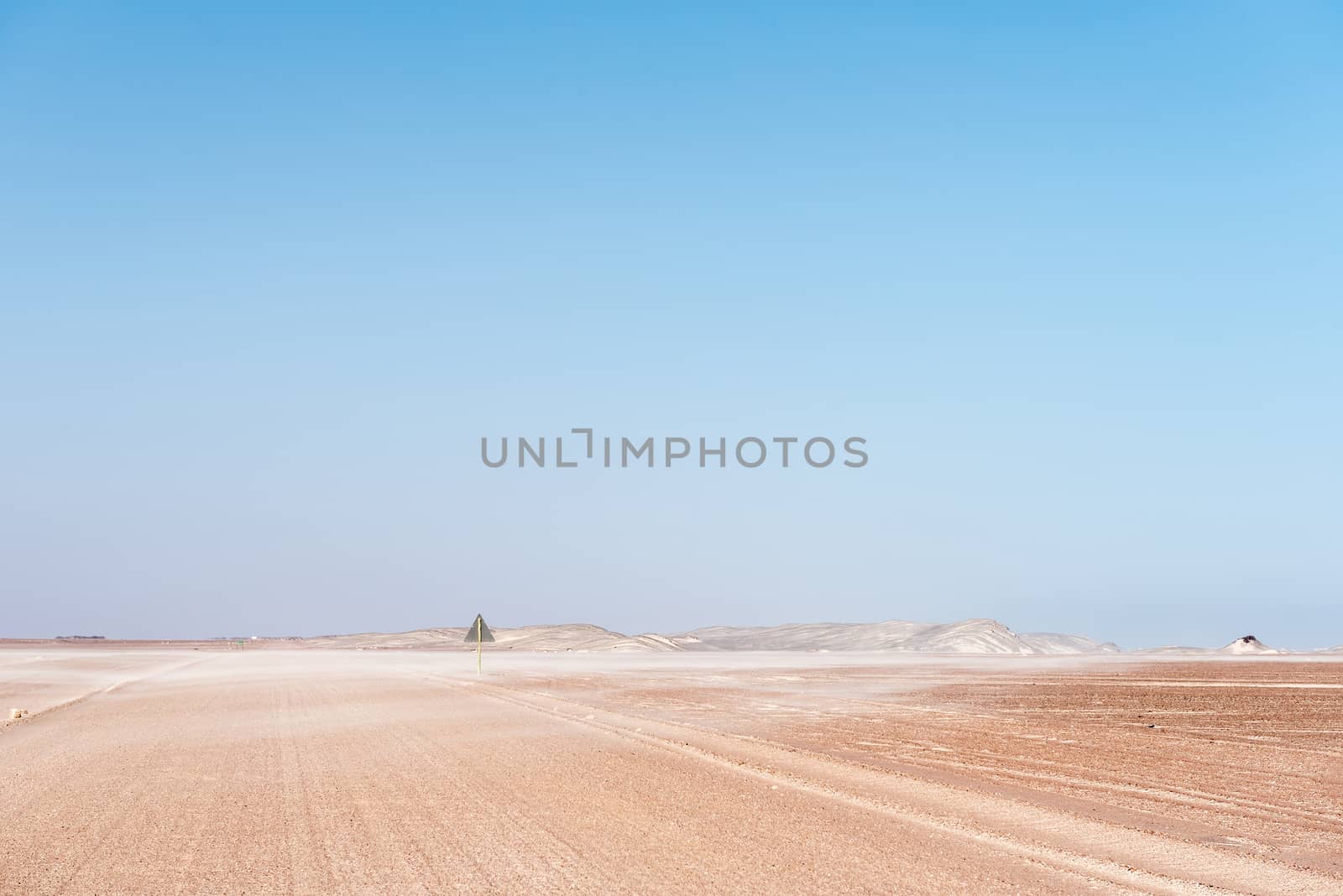 Sand blowing accross the C34-road between Henties Bay and Torra Bay in the Skeleton Coast area of Namibia