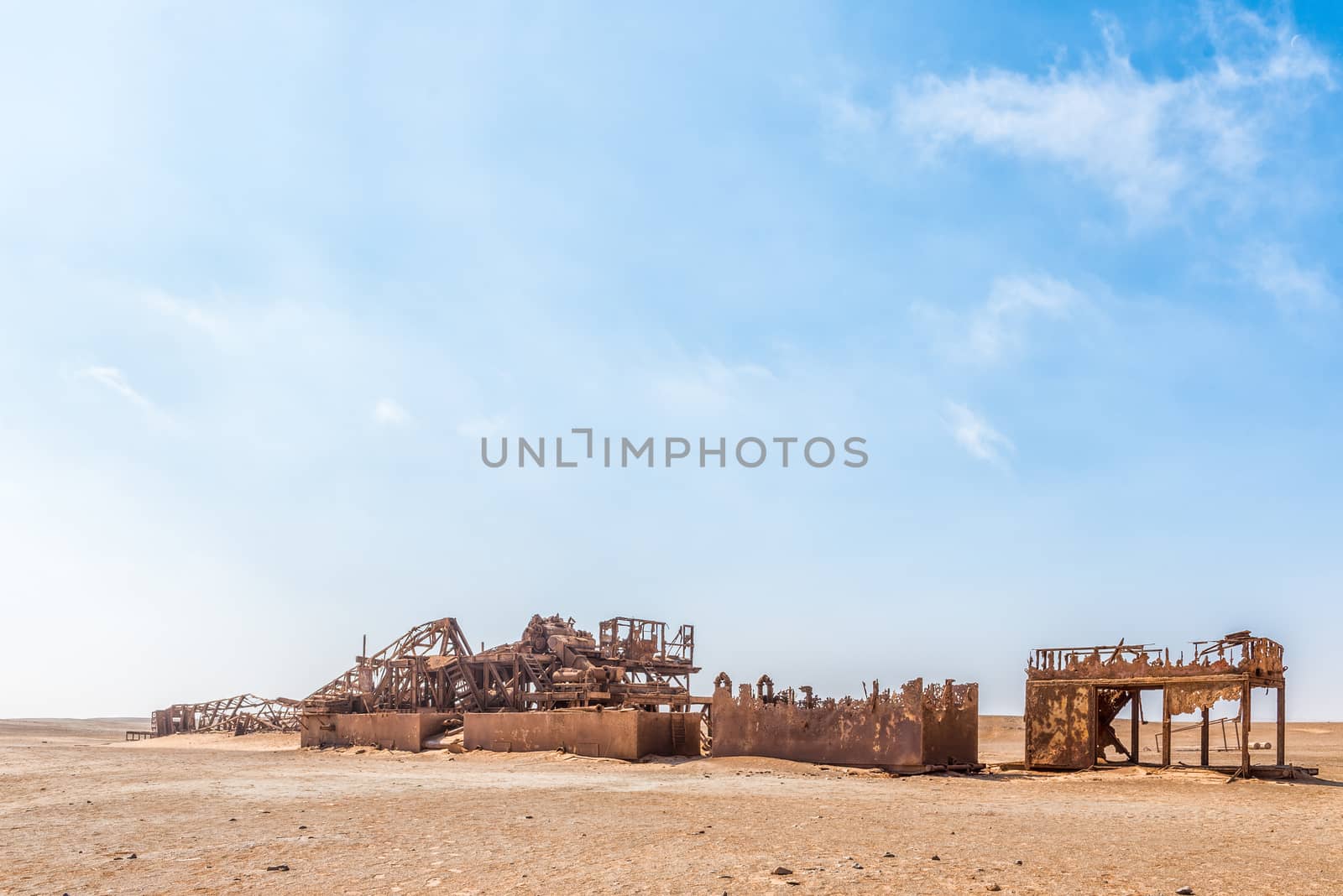 The rusted remains of an abandoned oil drilling rig between Henties Bay and Torra Bay in the Skeleton Coast area of Namibia