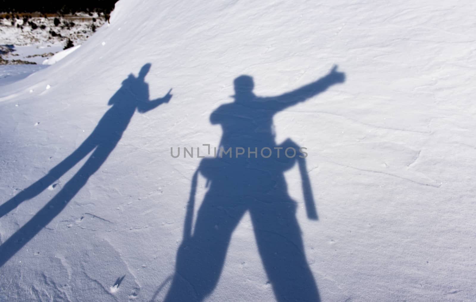 shadows of adventurous climbers