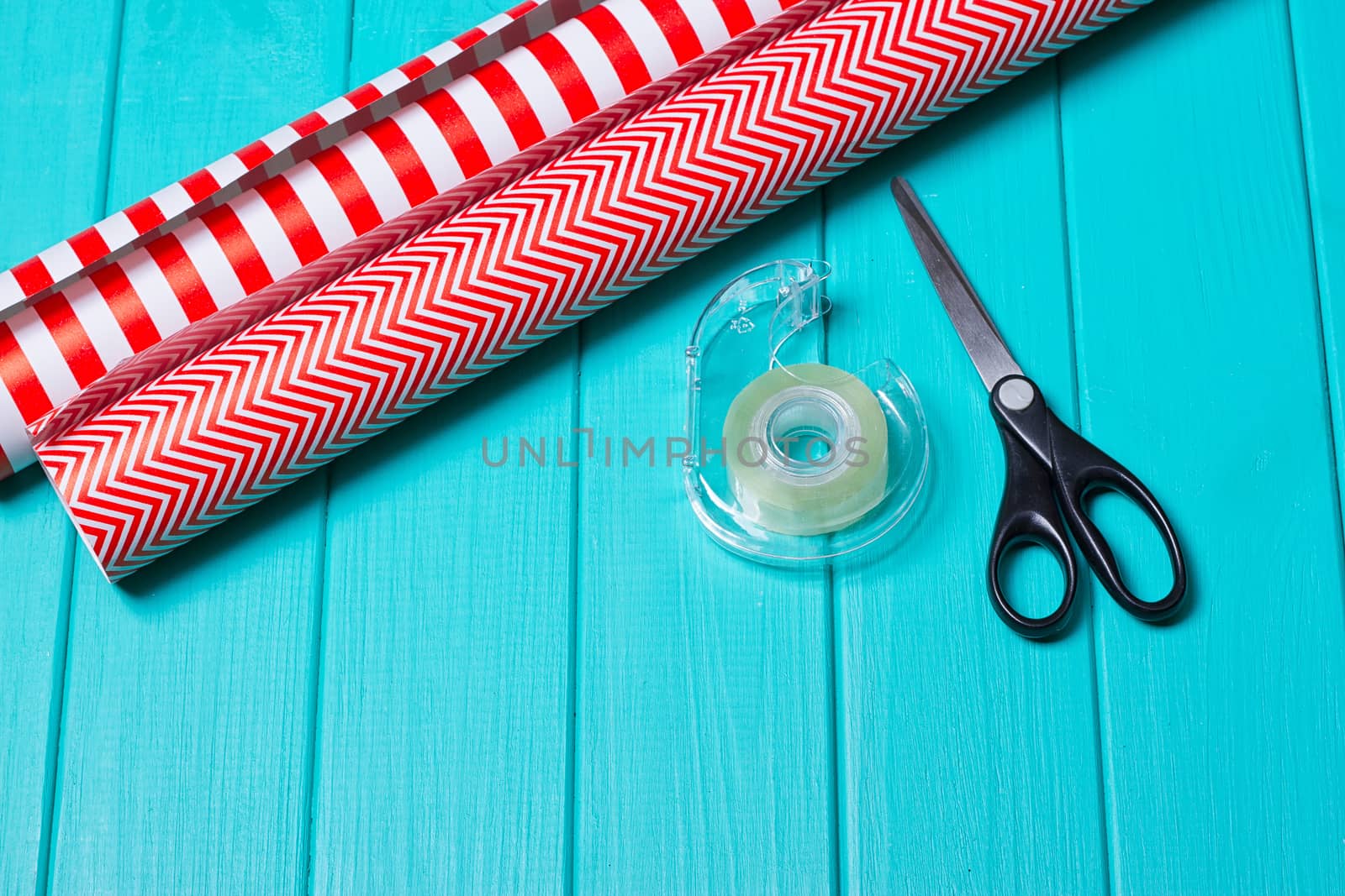 Christmas Gift Wrapping Party Time with Colorful Paper, Ribbon Bows, Scissors a by victosha