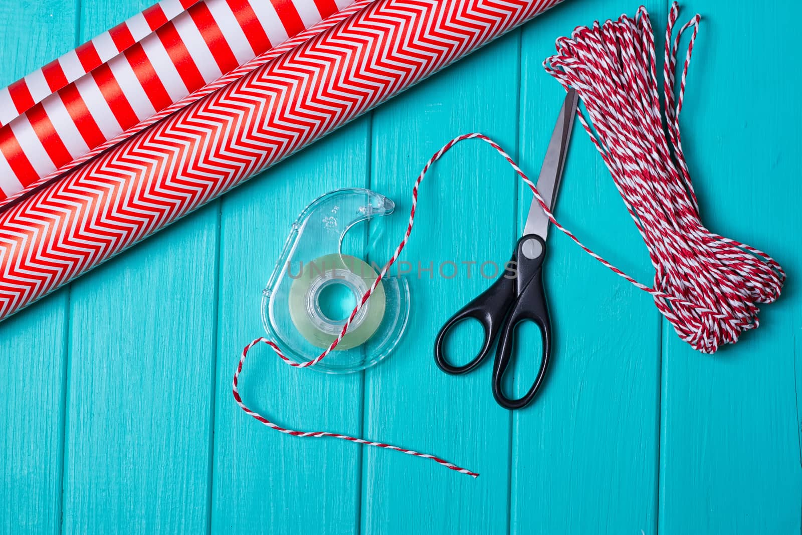 Christmas Gift Wrapping Party Time with Colorful Paper, Ribbon Bows, Scissors a by victosha