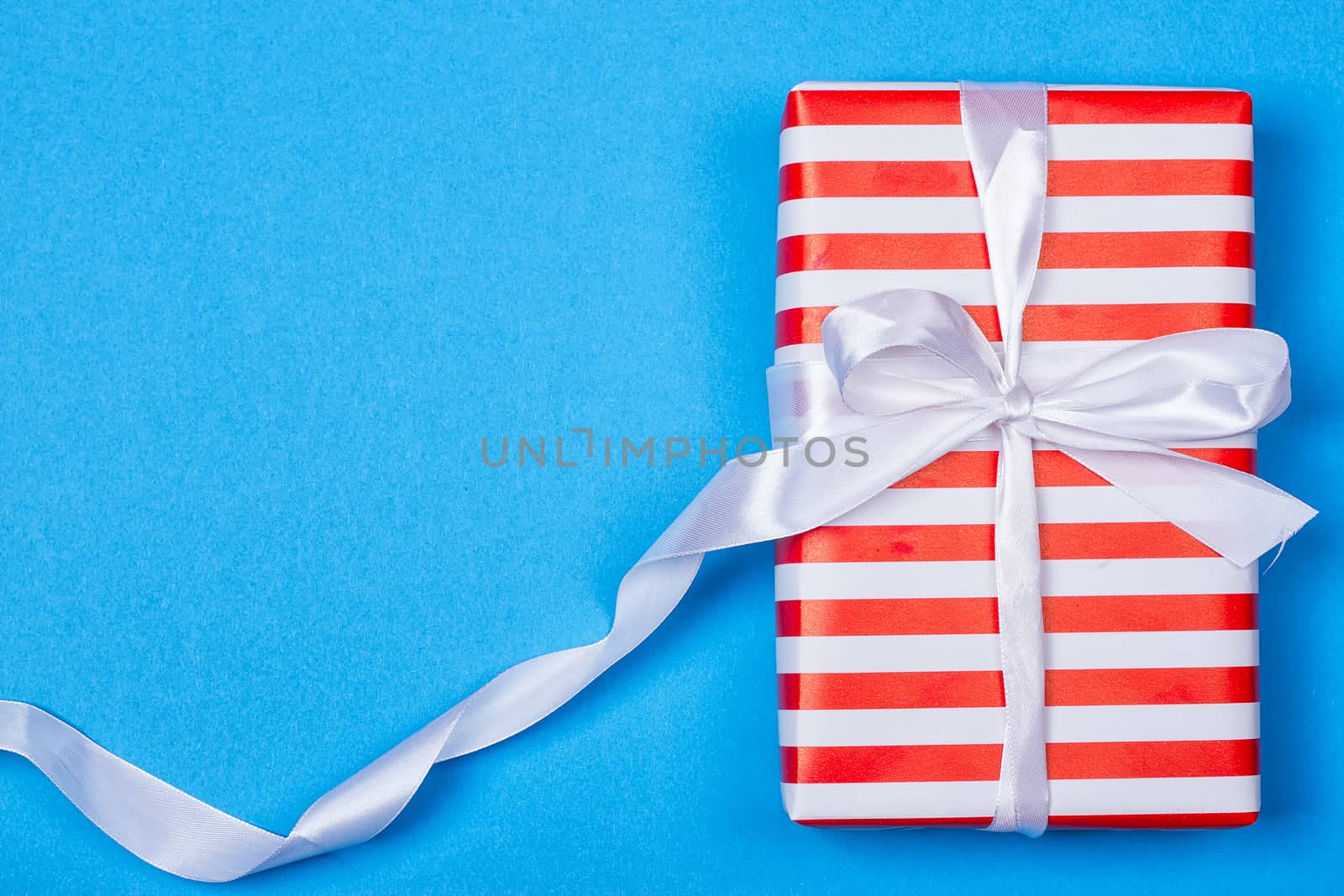 Gift in red and white packing with ribbon by victosha