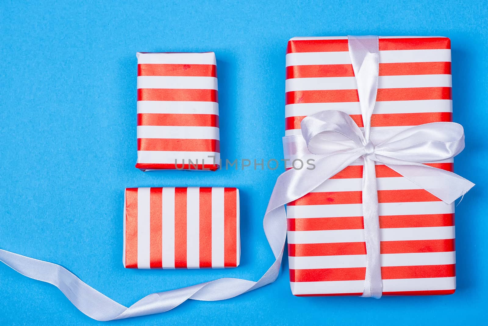 Several neatly laid out gifts in red packing by victosha