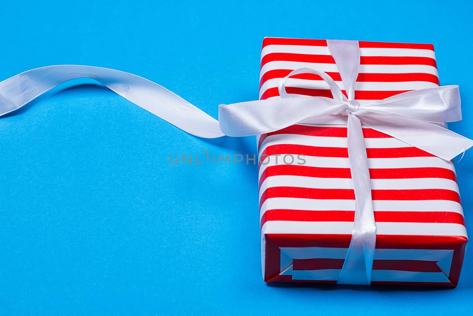 Gift in red and white packing with ribbon by victosha