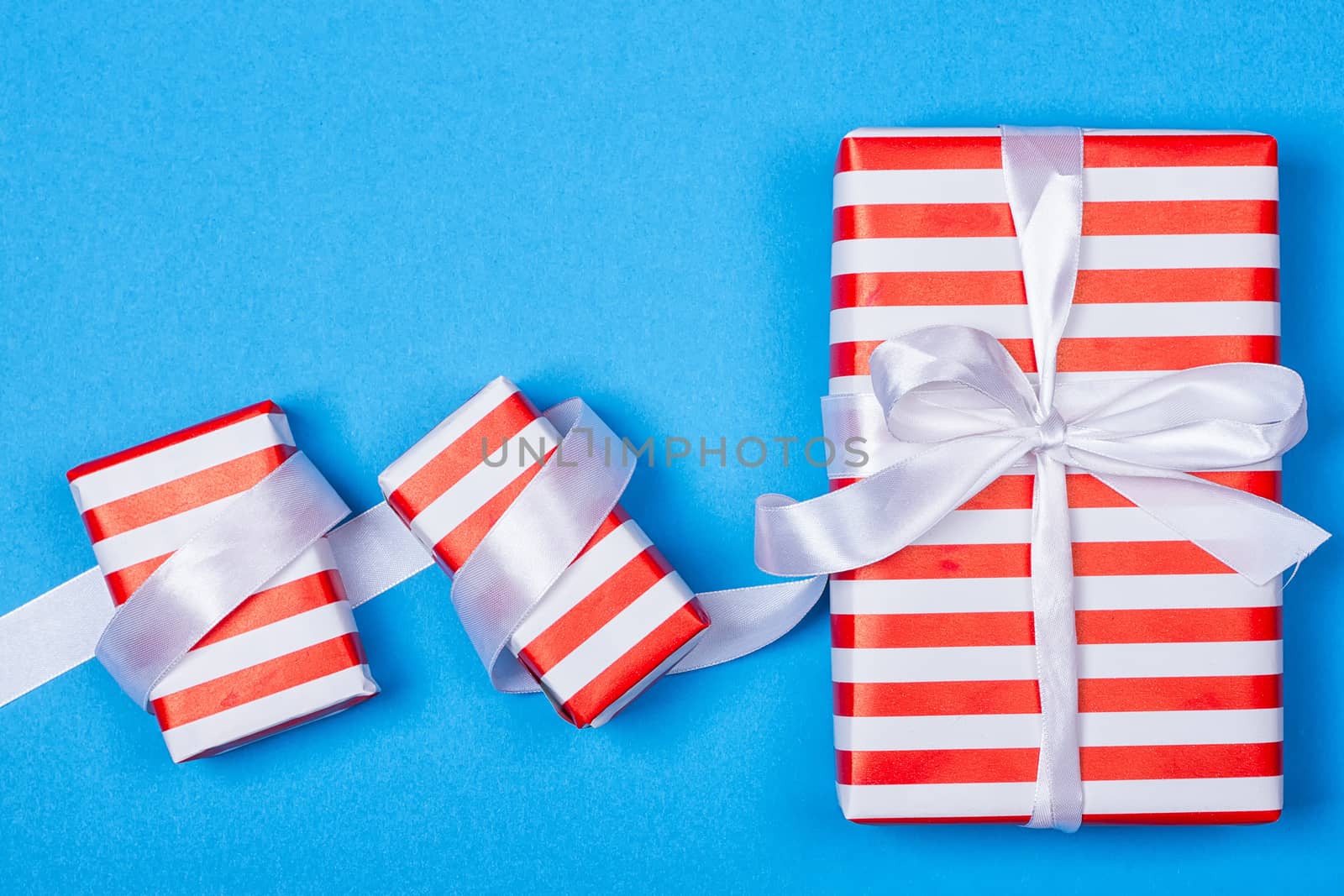 Several neatly laid out gifts in red packing by victosha
