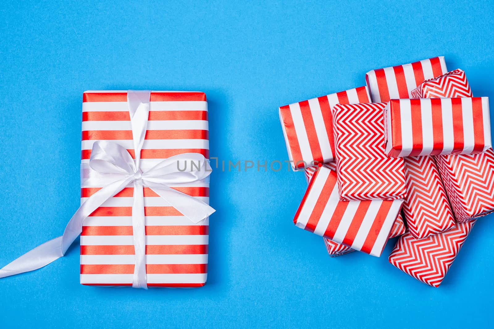 Hill red and white gifts on the blue background