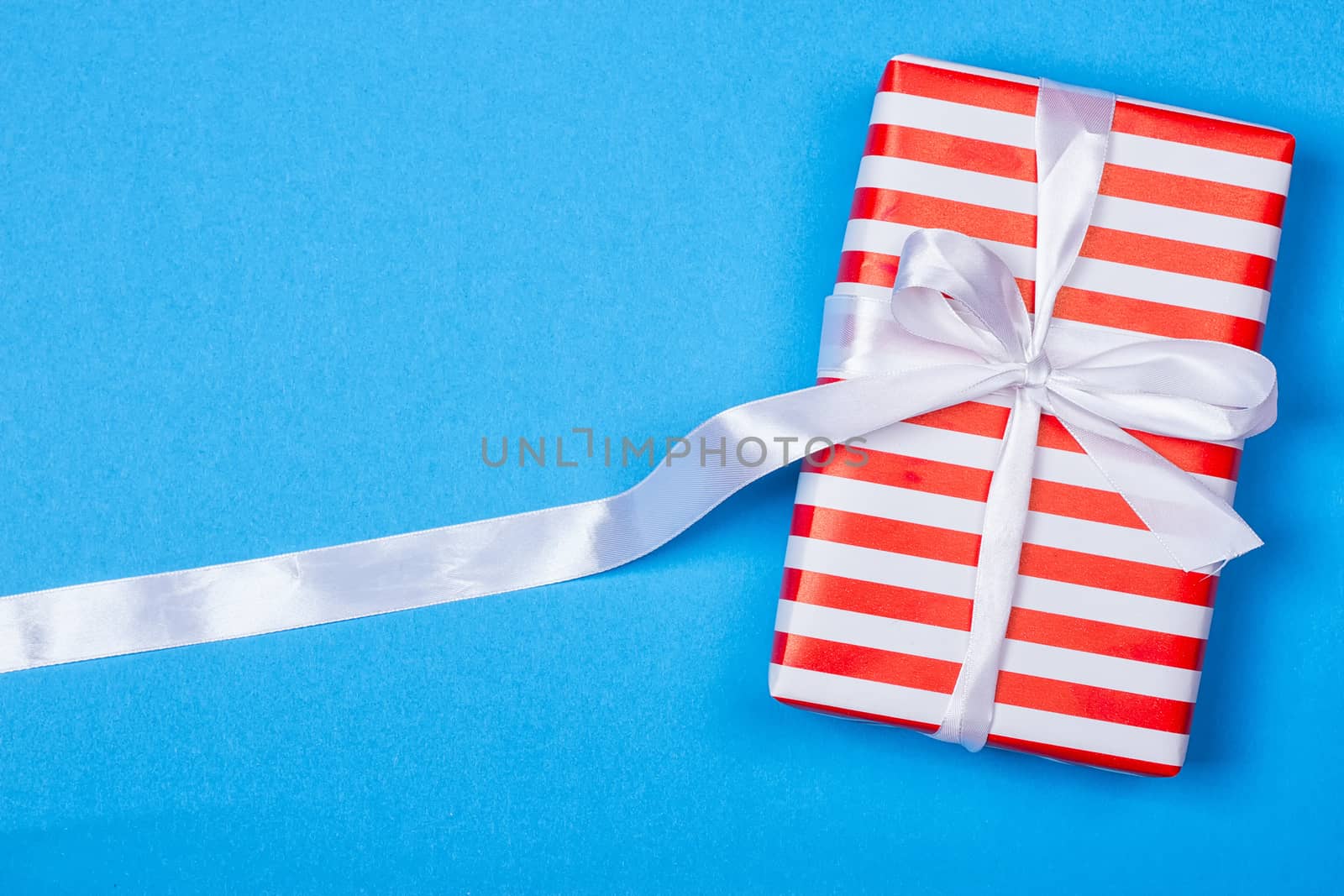 Gift in red and white packing with ribbon by victosha