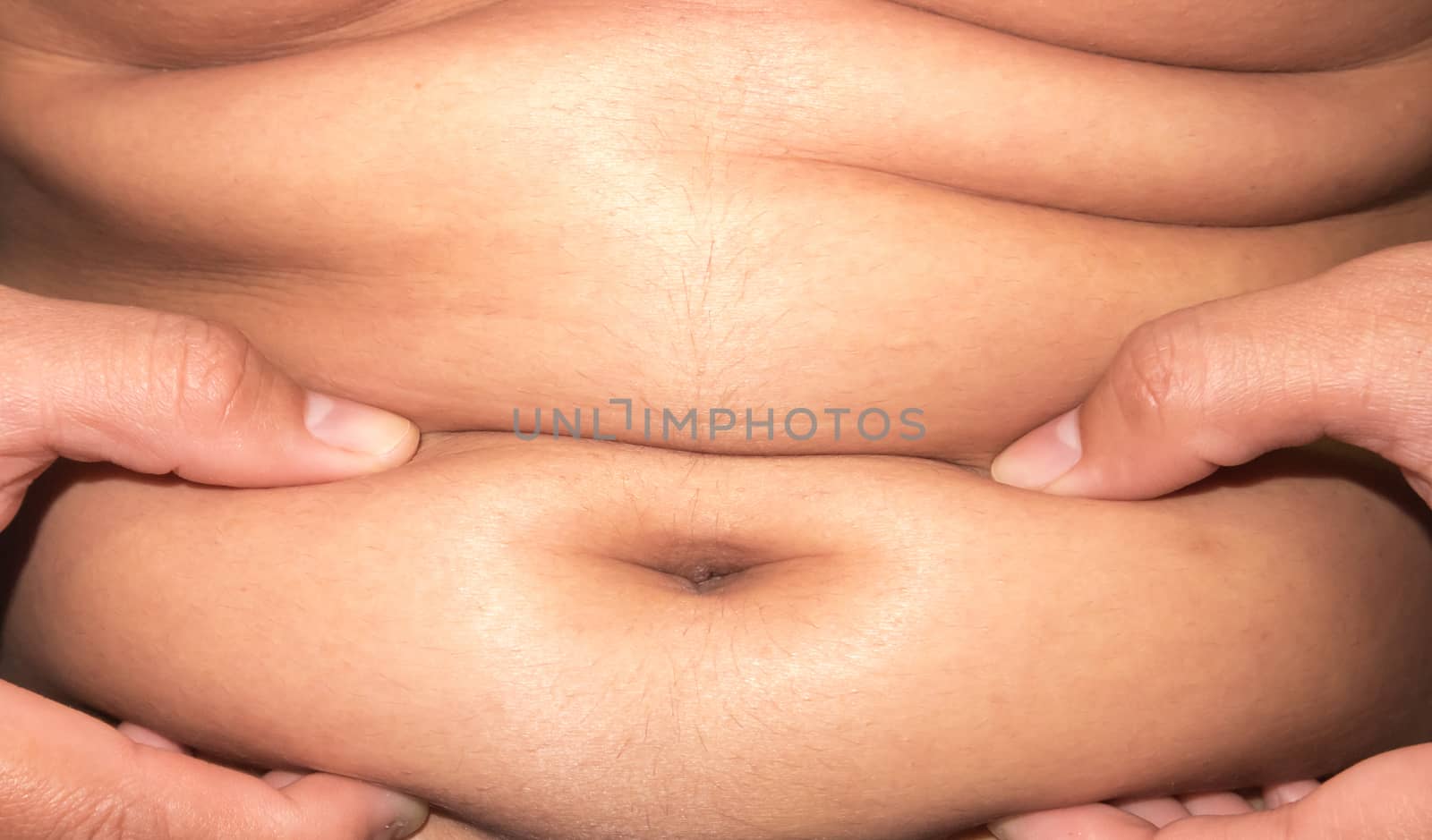 Closeup of abdominal surface woman fat, healthy care and beauty concept