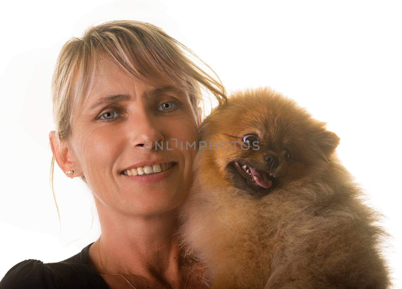 pomeranian dog and woman in front of white background